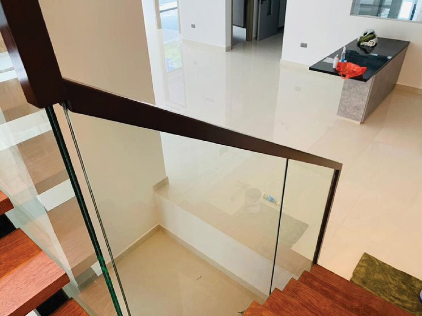 Frameless glass railing on an internal staircase