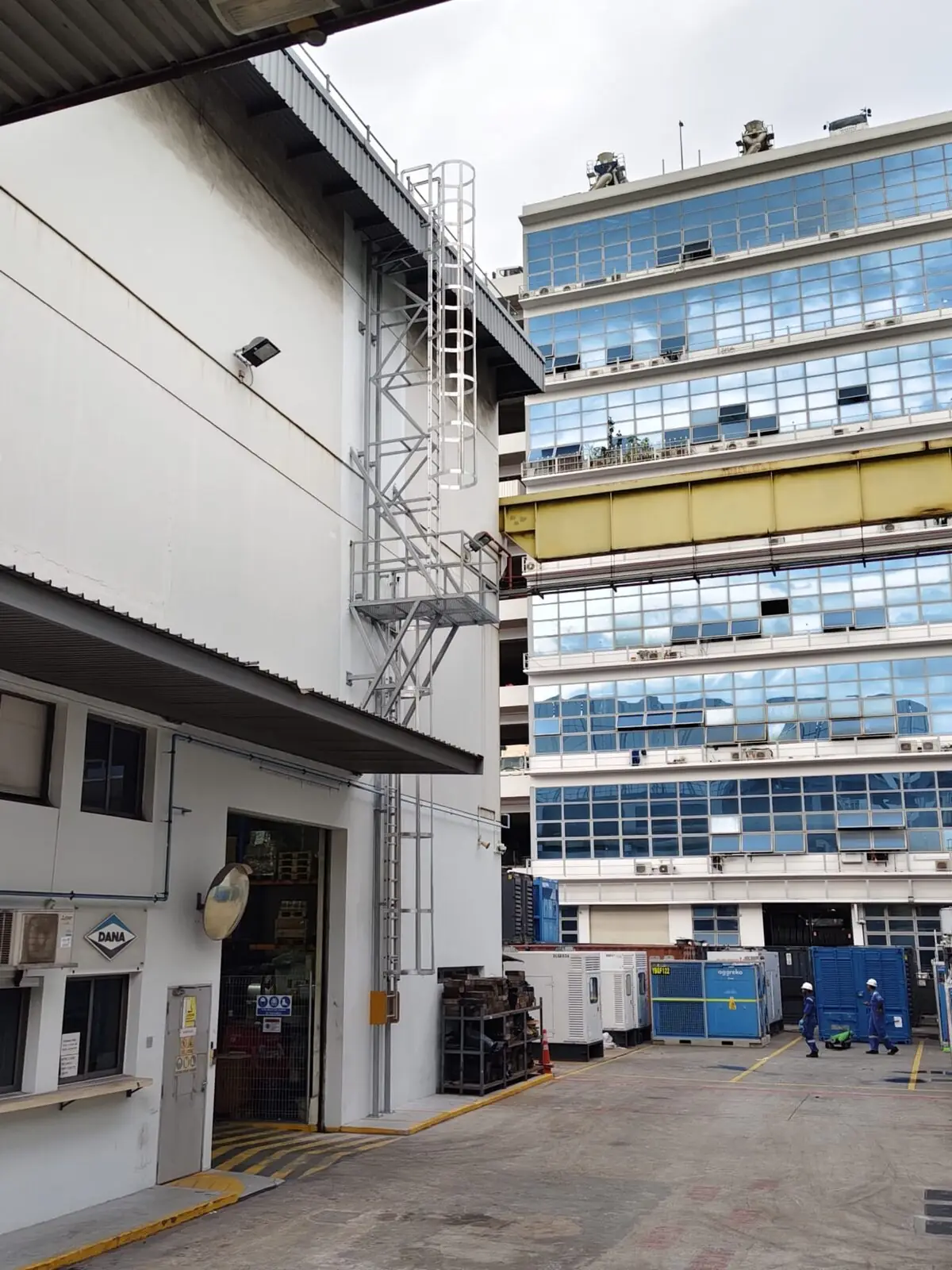 Buroh Street cat ladder with hoop guards and intermediate landing on a building elevation