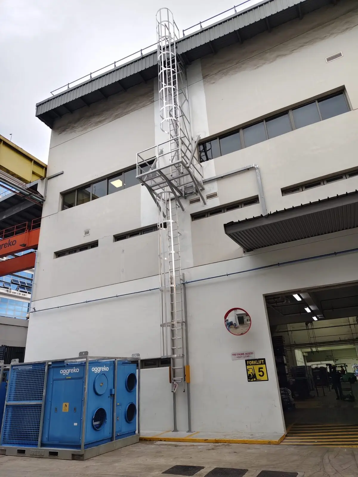 Buroh Street cat ladder with rest platform mounted to a Singapore industrial facade